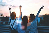 3 women looking into the sunset