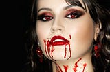 Woman, vampire, red lips red eyes blood around mouth and down neck, horror, bloodthirsty