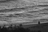 A lone figure at sea