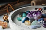 Pile of different beautiful gemstones in tray