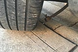 Picture of tire with broken steering rod