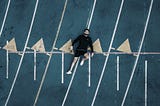 Man laying on starting line of a track