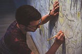 Man drawing on a wall. Discipline is not as strict as you think it is