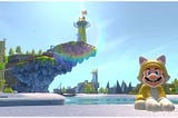 Mario sits (right) dressed in a yellow cat power up suit in front of a body of water. A piece of land juts up into the sky featuring a lighthouse (left), with more Mario level geometry on the horizon.