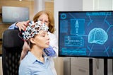 Doctor arranging scanning device on head of a female patient.