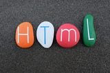 Coloured clay stones with HTML written on them