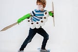 boy dressed as a toilet paper knight