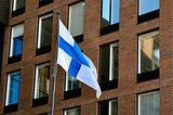 Finland flag in front of a building