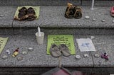 Children’s shoes at a vigil for Indigenous children murdered at Canadian residential schools.