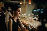 Single woman alone sitting in a bar