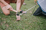 “Pounding in Tent Stakes”