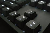 the arrow keys of a black keyboard