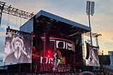 The band Green Day on stage at Emirates Old Trafford in Manchester. On the big screen is front man Billy Joe Armstrong