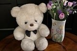 Small teddy bear with flowers