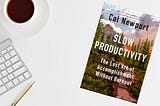 image of desktop with coffee cup and the book Slow Productivity by Cal Newport