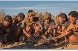 A group of San tribesmen (bushmen) confer.