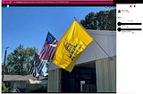 Screenshot from Wood’s FB page with 3 flags on a garage: Thin blue line with punisher, Three Percent US Flag, and a Gadsden Flag