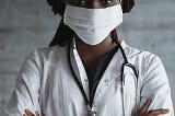 Photo of woman with stethoscope and mask