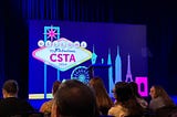 A dark purple stake background, saying welcome to fabulous CSTA 2024.