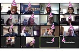 Screenshot of zoom call with people laughing and smiling, with photoshopped pink stripped birthday hats on everyone’s heads.