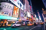 Brightly lit and busy Times Square, NY: A mecca for theater