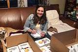 Terry smiling and signing her book Winning the Game of Work.