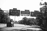 Bronx River Parkway photo from dashboard Exit Fordham Road Bronx in Black and White. Photo property of Author.