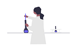 Scientist adds liquid to a beaker in a lab