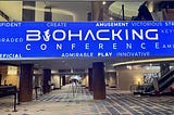 Electronic banner displayed in the main entry of the convention center for the Biohacking Conference in Orlando.