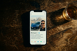 Overhead shot of a phone that shows a man’s dating profile