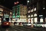 Night streets of Milan under the red lights of Ray Ban.