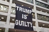 trump is guilty banner in senate office bldg