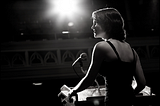 Woman delivering speech at podium