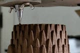 3D Printing in Clay: Using A Synchronized Auger Extruder With a Mechanical Supply Feed