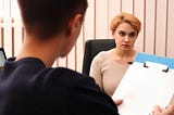 A patient, a doctor, in a clinic.