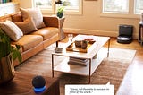 A living room of a modern home featuring a Roomba J7 and an Alexa Echo.