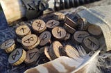 Picture of wooden pieces, each with a rune written on it