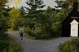 A composite image made from three images showing a man walking past a church in the woods on his way to finding his personal spirituality.