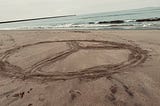 Peace Sign in Sand. Copyrighted by Mark Tulin.