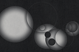 A collection of circles and spheres in different shapes and sizes, overlapping at certain points, yet all of them going in their own directions.