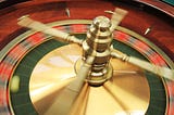 a spinning roulette wheel with a roulette ball inside