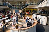 Students walking through a main hub between classes at Bryant University