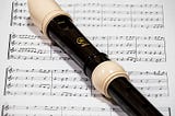 Photo of an alto-treble recorder with music