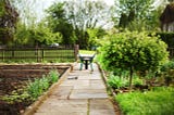 Garden, path, fence, trees, wheelbarrow