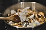 Photo of veggies in a skillet.