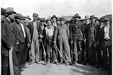 black and white picture of people on strike. Or maybe it’s a picture of something else. I don’t really know. I just took the picture from one of Philip’s story, which you should NOT read