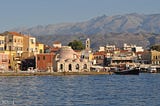 The town of Chania seen from the lighthouse. In the background, the beautiful mountains called lefka ori.