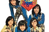 Cropped image of Finger 5’s ‘First Album’ with group members wearing blue or yellow collared shirts and plaid, color coordinated overalls.