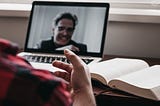 Man talking to another man on video call