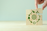 a hand putting a piece of the puzzle of circular economy